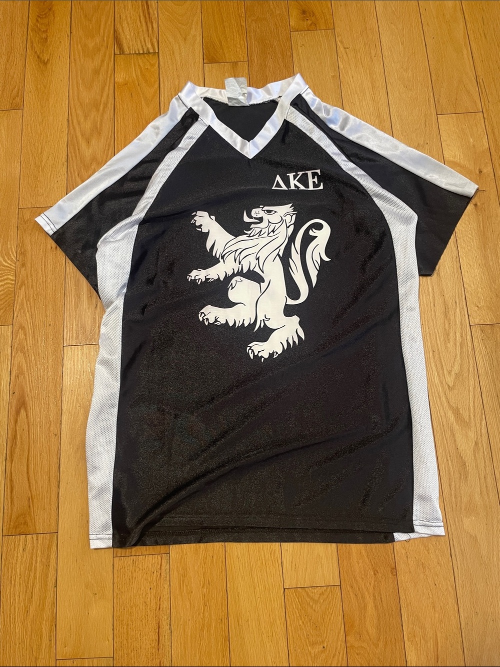 Black and White Men's Athletic Jersey with Lion Crest